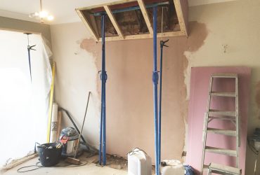 Why is it important to hire a professional for chimney breast removal?