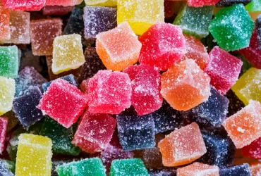 How do THC gummies compare to other forms of THC consumption in terms of wellness effects?